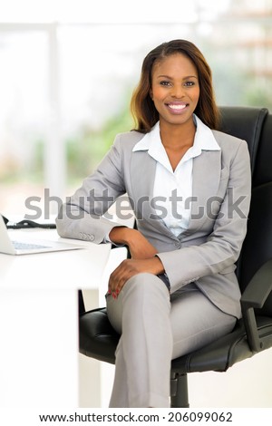 attractive african female business executive in modern office