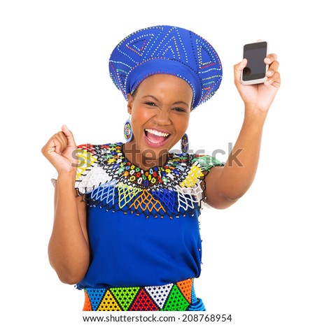 excited south african woman holding mobile phone