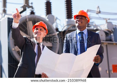 professional managers working in electrical substation