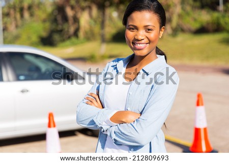 portrait of pretty african student driver in testing ground