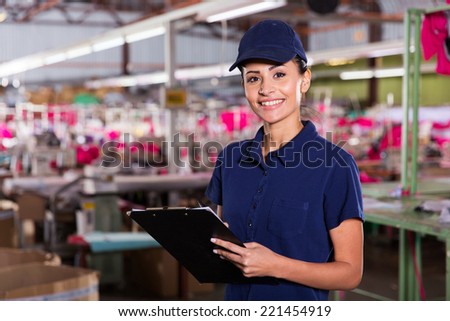 beautiful female clothing factory worker with clipboard