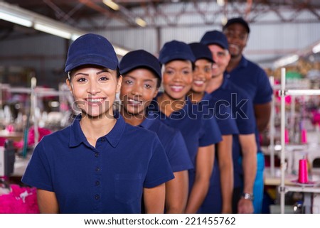 group of machinists line up in clothing factory