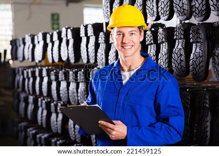 gum boots factory warehouse worker with clipboard