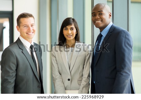 group of multicultural businesspeople standing in modern office