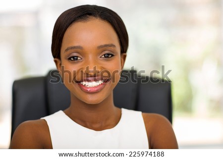 pretty young african office worker in office