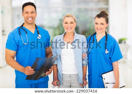 portrait of happy medical doctors with middle aged patient