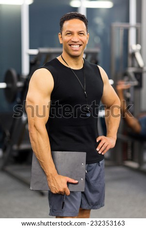 muscular male gym trainer portrait