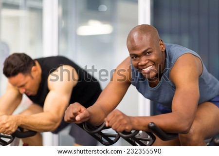 healthy men on gym bike