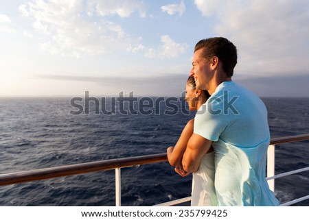 happy couple enjoying sea view in the morning on a cruise ship
