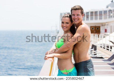 happy young couple on summer holiday on a cruise ship
