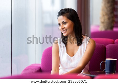 pretty woman sitting in a coffee shop