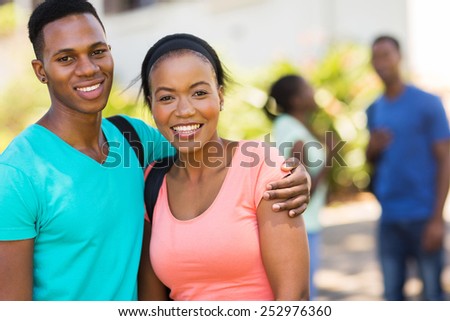 portrait of cute african college couple on campus