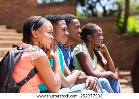 group of happy african college students looking away