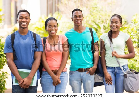 group of happy african college students standing together on campus