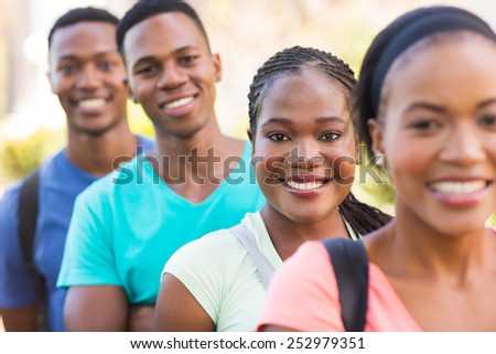 group of attractive african american college students outside on campus