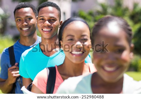 handsome male african american student standing in a row