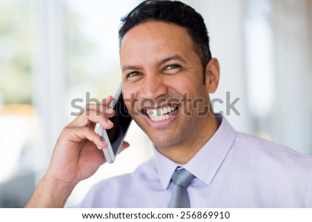 successful middle aged business man talking on cell phone
