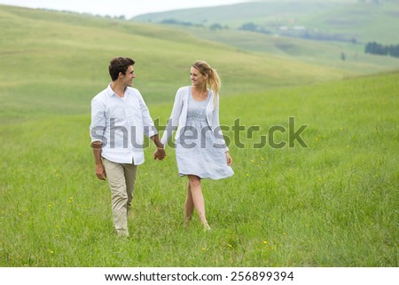 lovely couple walking on countryside