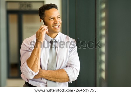 portrait of successful businessman talking on cell phone