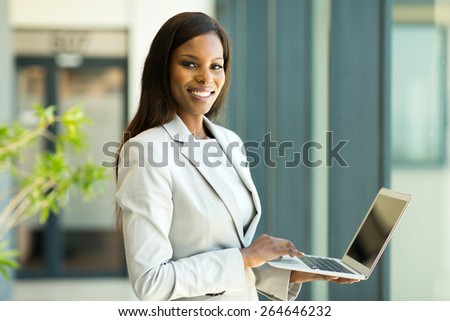 portrait of young african american business woman with laptop