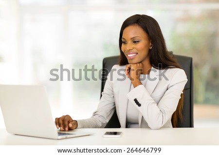 portrait of beautiful young african business woman in office