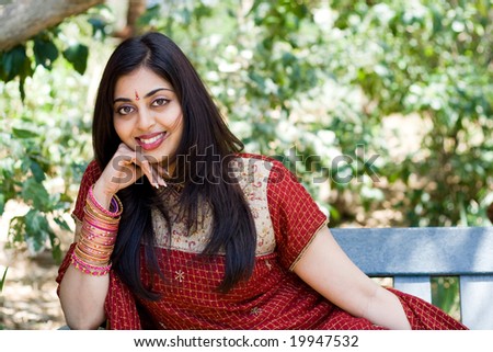 indian woman sitting on bench