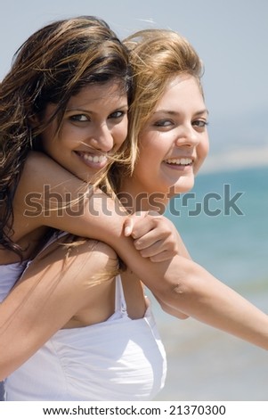 two beautiful woman best friends on beach having fun