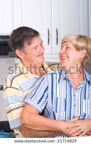 happy senior couple hugging