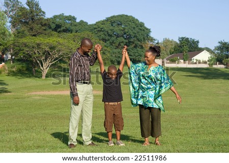 happy african family playing in the park