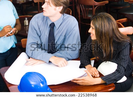 two construction managers place order in a cafe