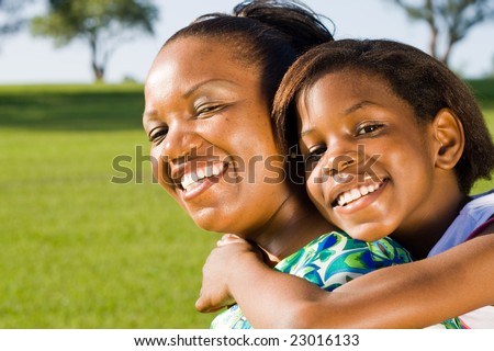 happy african mother and daughter together