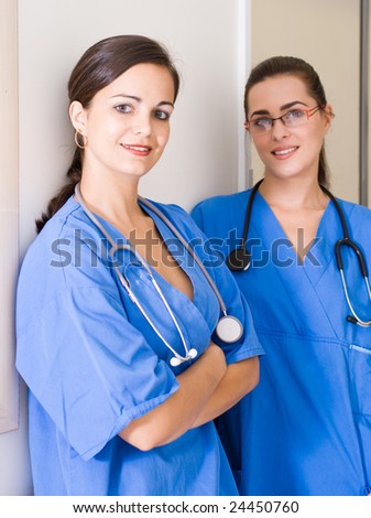 two medical professionals talking in the hallway