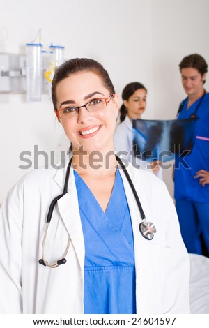 female doctor portrait with colleagues