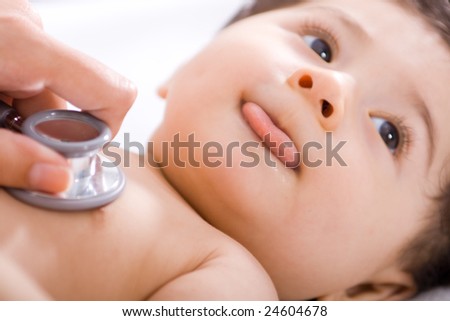 pediatrician checking cute baby boy