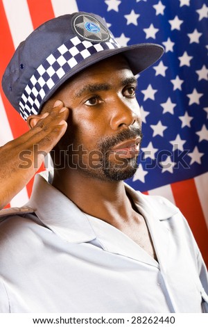 african american policeman saluting, background is USA flag