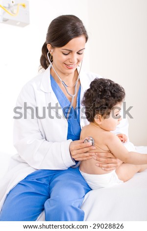 female pediatrician checking cute baby boy