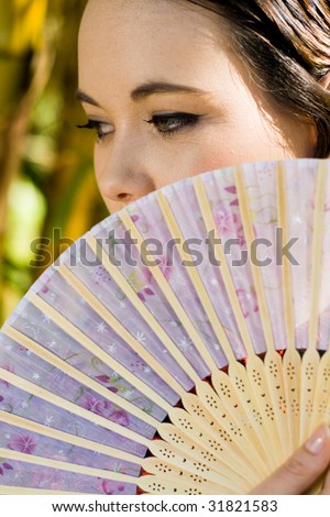 pretty woman with a chinese fan