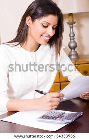 young woman paying bill on internet banking
