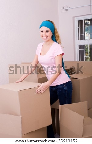 young woman moving in new apartment