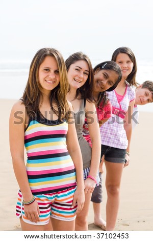 stock photo group of young teen on beach