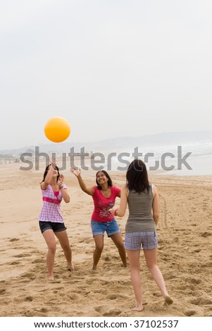 stock photo group of teen girls playing beach ball