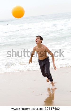 stock photo teen boy playing beach ball Save to a lightbox 