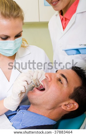 young man visiting dentist for dental checkup