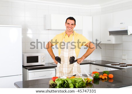 young happy man in a modern kitchen