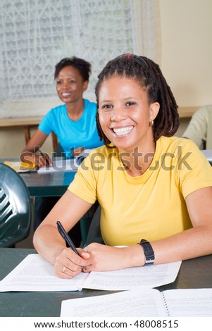 happy female african american adult students in classroom