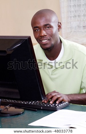 african american student studying computer
