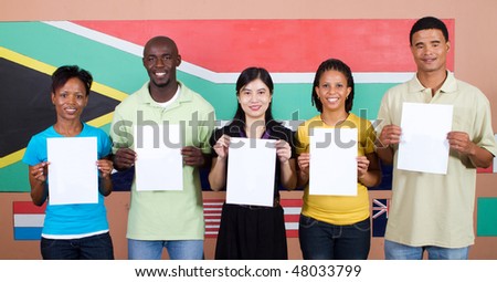 young group of South African people holding blank signs before South Africa flag, 2010 Fifa world cup concept