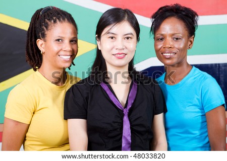 group of young South African people standing in front of South Africa flag, 2010 FIFA world cup concept