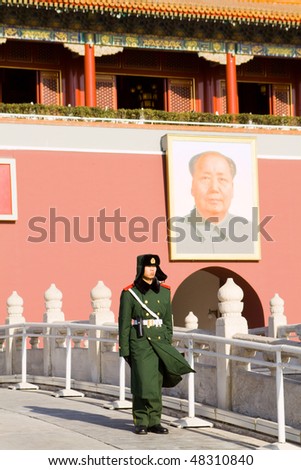 BEIJING, CHINA - DECEMBER 17: A paramilitary police officer guards Tian\'anmen square on December 17, 2009 in Beijing, China.