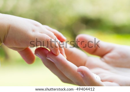 mother and baby\'s hands